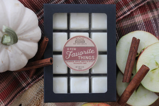 Everyday North Soy Wax Melts. A Few Favorite Things. Pumpkin, Apple, Maple and Spice. Phthalate Free. 3 oz. 80 grams. Decor Surrounding 12 Tray Wax Melt Undyed Black Box.