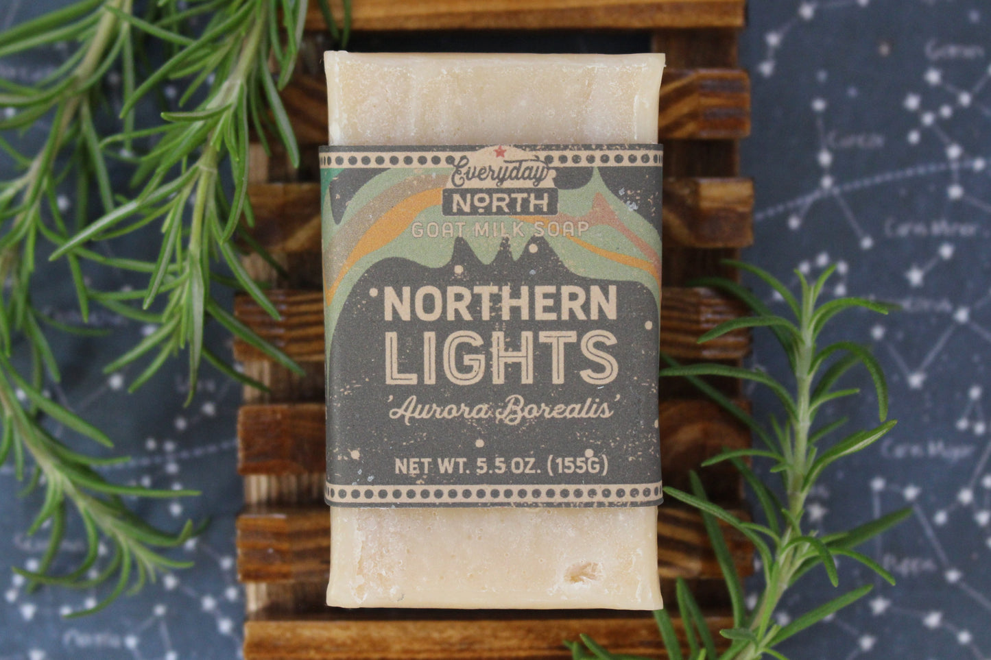 Undyed Soap Bar on Soap Dish. Wrapped in Kraft Label. Everyday North Goat Milk Soap. Northern Lights. Aurora Borealis. 5.5 oz. 155 grams. Surrounded by decor.