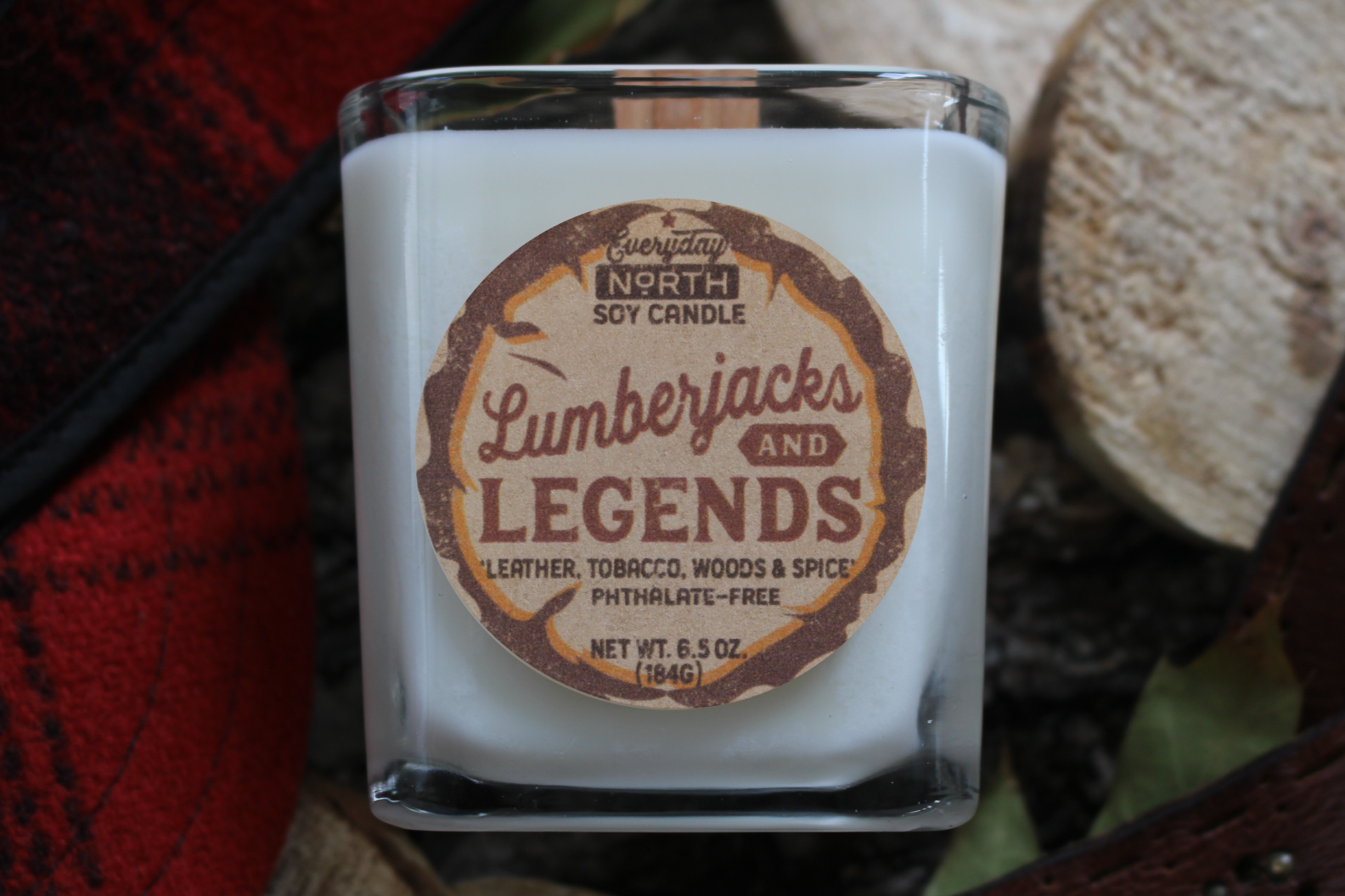 Everyday North Wood Wick Soy Candle. Lumberjacks and Legends. Leather, Tobacco, Woods and Spice. Phthalate Free. 6.5 oz. 184 grams. Decor Surrounding Undyed Soy Wax Candle in Cube Glass Jar.