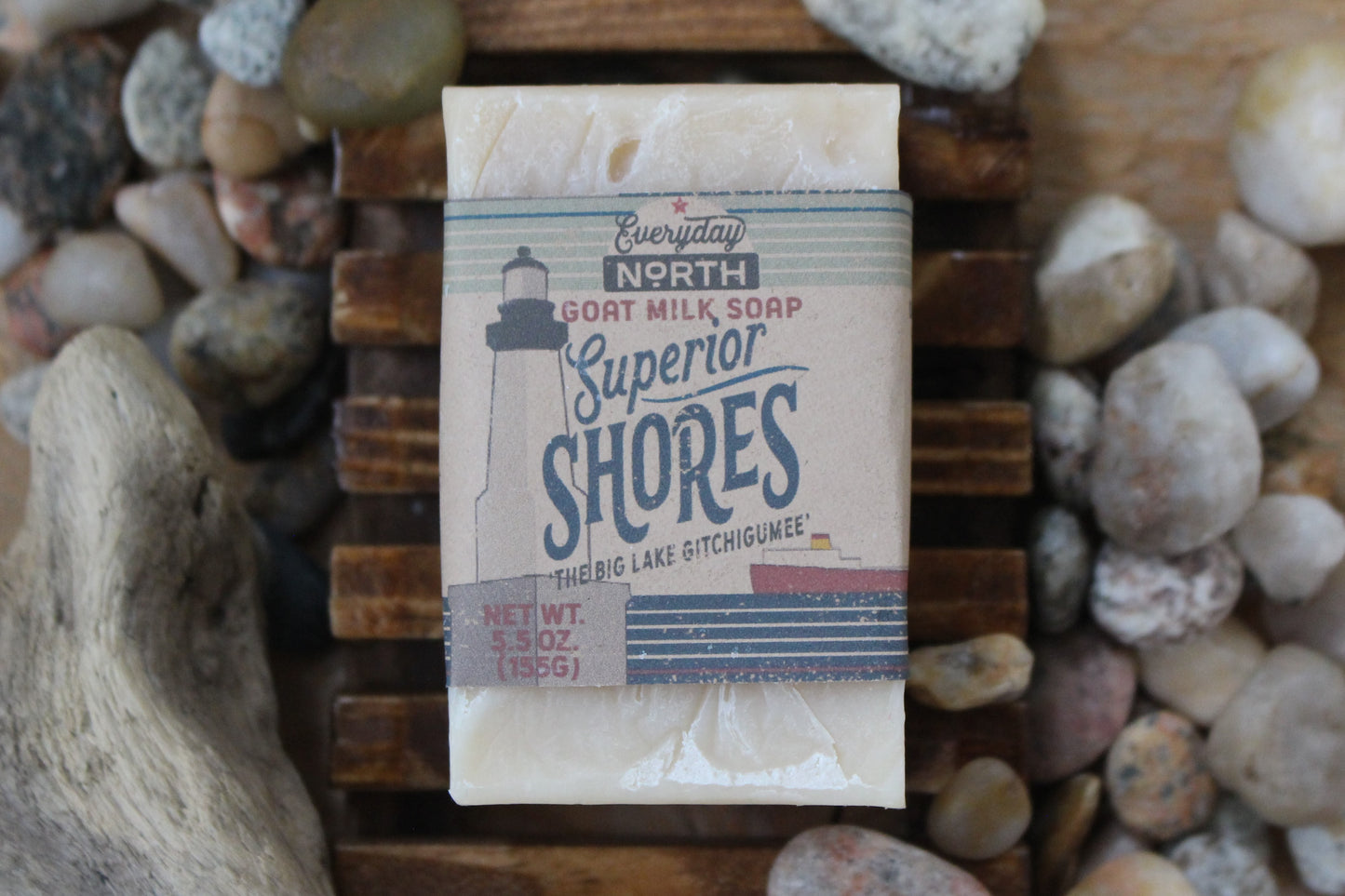 Undyed Soap Bar on Soap Dish. Wrapped in Kraft Label. Everyday North Goat Milk Soap. Superior Shores. The Big Lake Gitchigumee. 5.5 oz. 155 grams. Surrounded by decor.