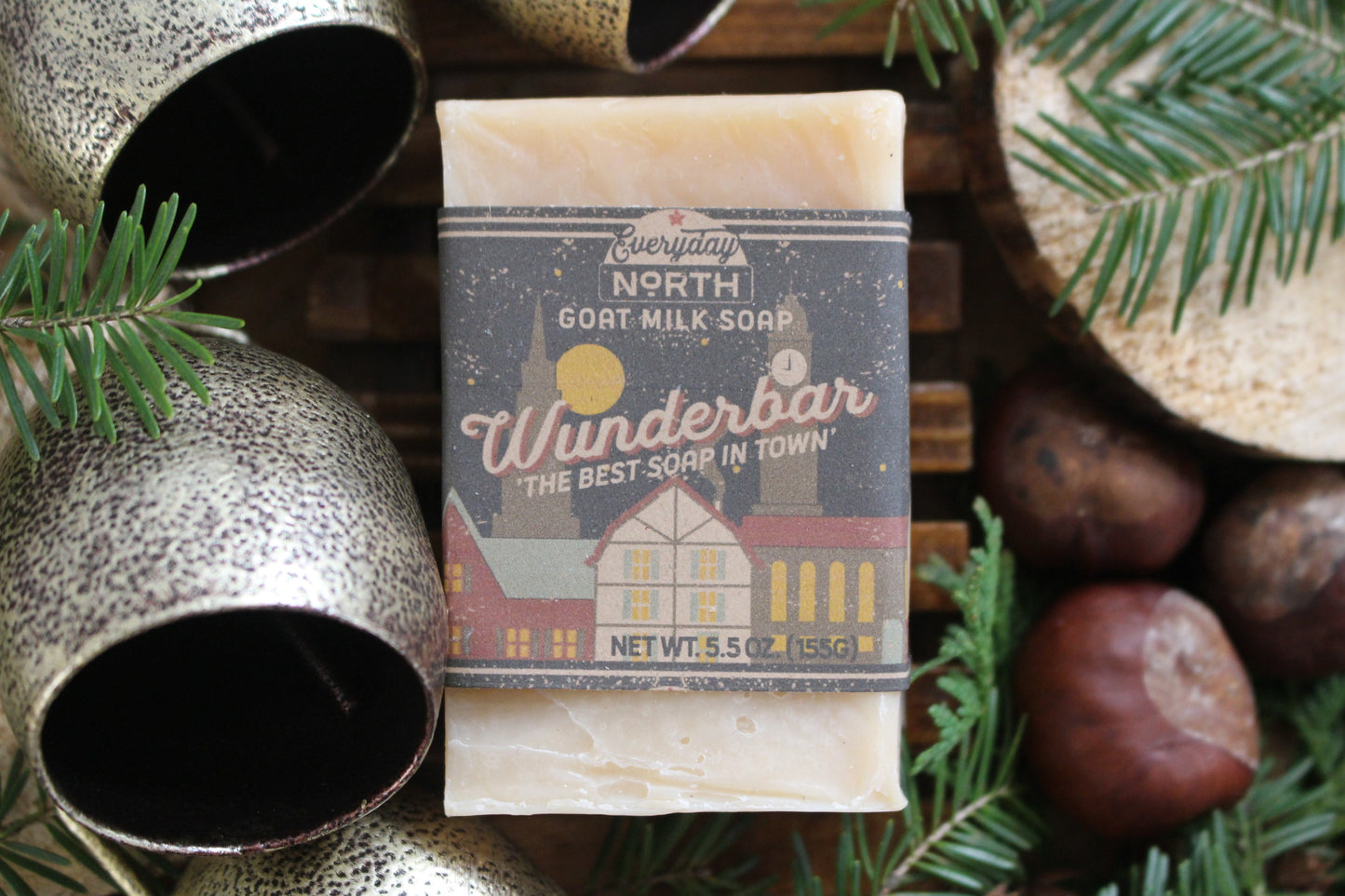 Undyed Soap Bar on Soap Dish. Wrapped in Kraft Label. Everyday North Goat Milk Soap. Wunderbar. The Best Soap In Town. 5.5 oz. 155 grams. Surrounded by decor.