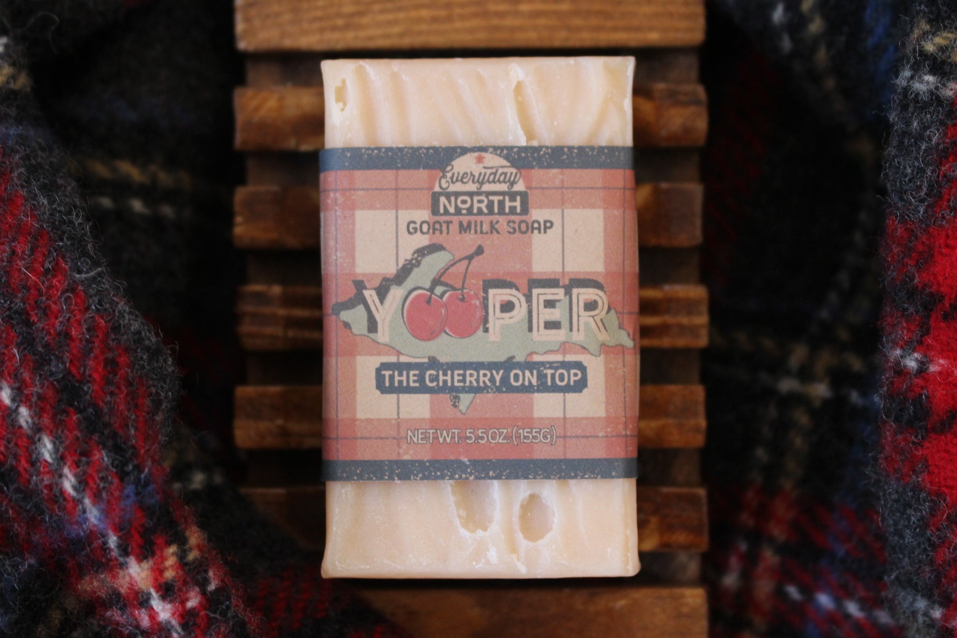 Undyed Soap Bar on Soap Dish. Wrapped in Kraft Label. Everyday North Goat Milk Soap. Yooper. The Cherry On Top. 5.5 oz. 155 grams. Surrounded by decor.