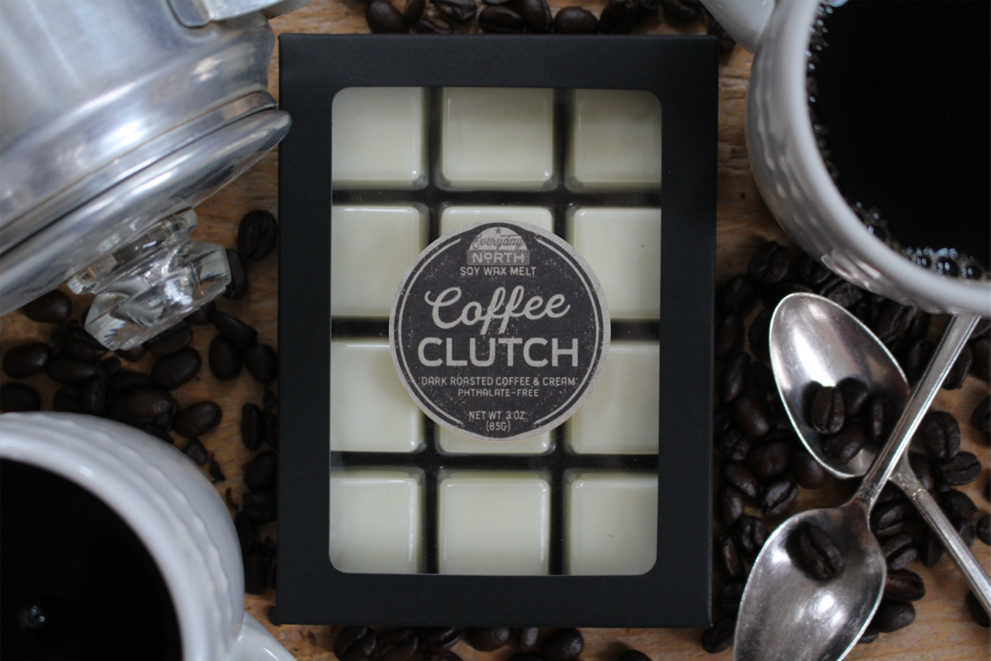 Everyday North Soy Wax Melts. Coffee Clutch. Dark Roasted Coffee and Cream. Phthalate Free. 3 oz. 80 grams. Decor Surrounding 12 Tray Wax Melt Undyed Black Box.