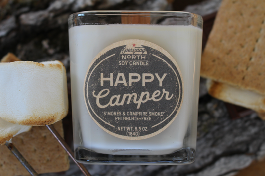 Everyday North Wood Wick Soy Candle. Happy Camper. Smores and Campfire Smoke. Phthalate Free. 6.5 oz. 184 grams. Decor Surrounding Undyed Soy Wax Candle in Cube Glass Jar.