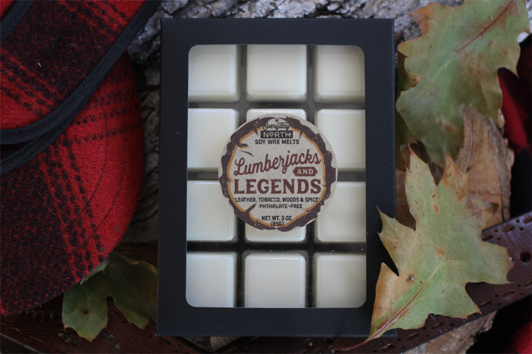 Everyday North Soy Wax Melts. Lumberjacks and Legends. Leather, Tobacco, Woods and Spice. Phthalate Free. 3 oz. 80 grams. Decor Surrounding 12 Tray Wax Melt Undyed Black Box.