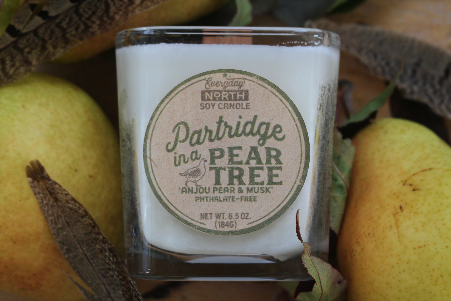 Everyday North Wood Wick Soy Candle. Partridge in a Pear Tree. Anjou Pear and Musk. Phthalate Free. 6.5 oz. 184 grams. Decor Surrounding Undyed Soy Wax Candle in Cube Glass Jar.