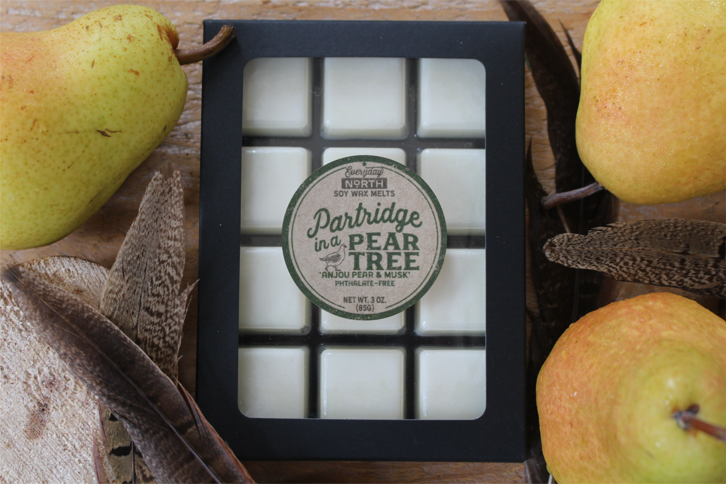 Everyday North Soy Wax Melts. Partridge in a Pear Tree. Anjou Pear and Musk. Phthalate Free. 3 oz. 80 grams. Decor Surrounding 12 Tray Wax Melt Undyed Black Box.