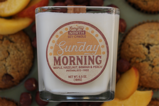 Everyday North Wood Wick Soy Candle. Sunday Morning. Maple, Hazelnut, Banana and Peach. Phthalate Free. 6.5 oz. 184 grams. Decor Surrounding Undyed Soy Wax Candle in Cube Glass Jar.
